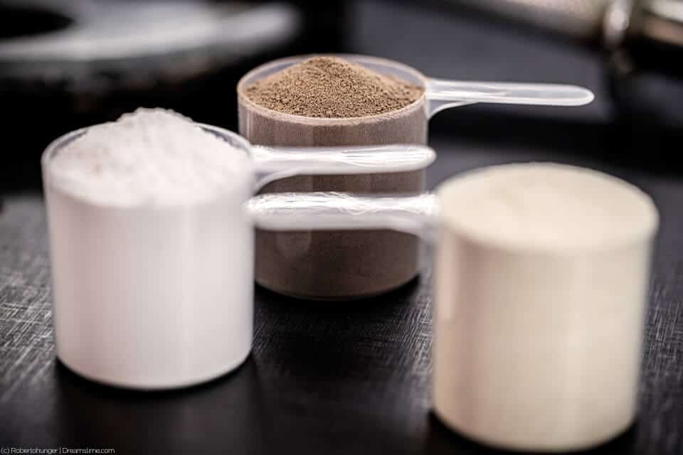 Casein protein powder in three scoops
